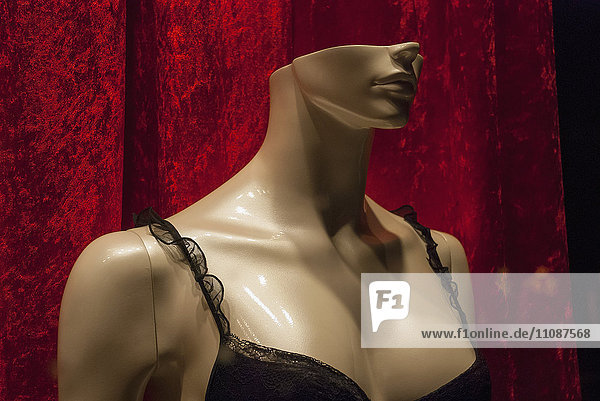 Close-up of mannequin wearing black bra for retail display at store