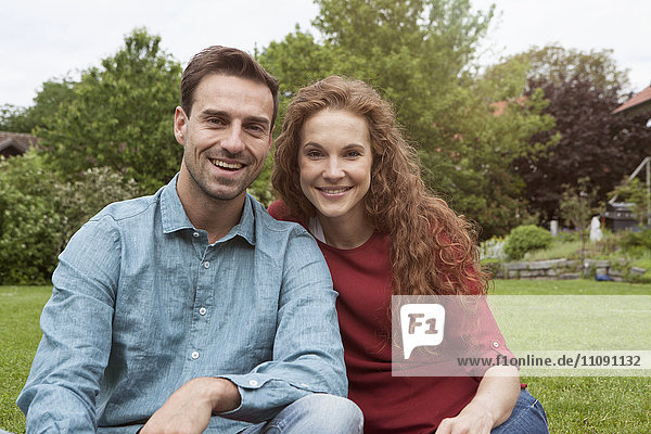 Portrait of smiling couple in garden