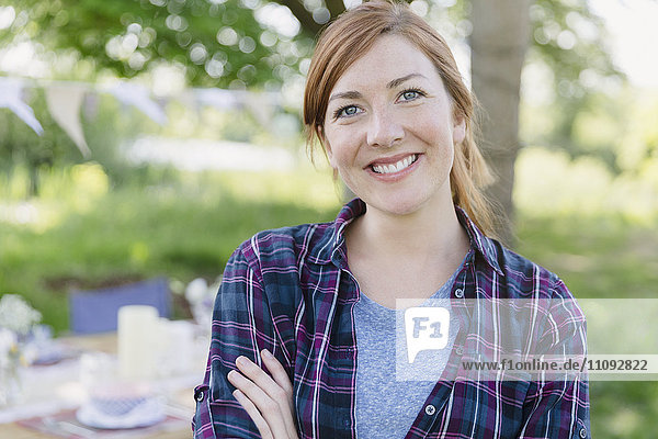 Portrait smiling woman in backyard