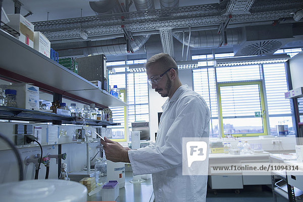 Male scientist working in a pharmacy laboratory