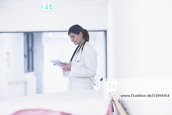 Young female doctor using a digital tablet in hospital