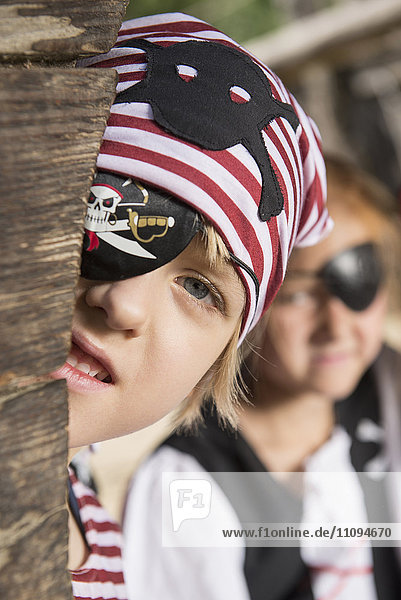 Boy dressed up as pirate playing in a playground  Bavaria  Germany