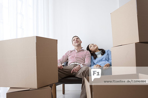 Couple Moving House Resting