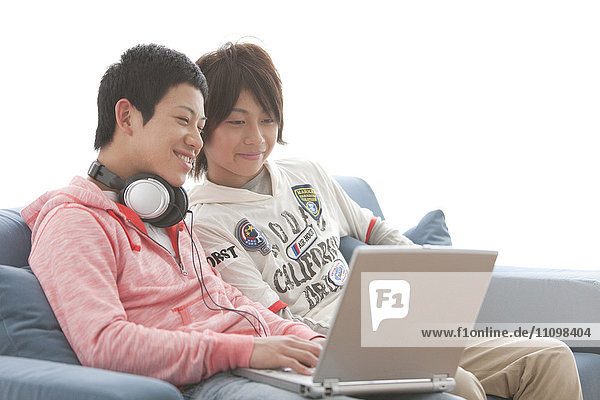 Teenage Boys Using Laptop