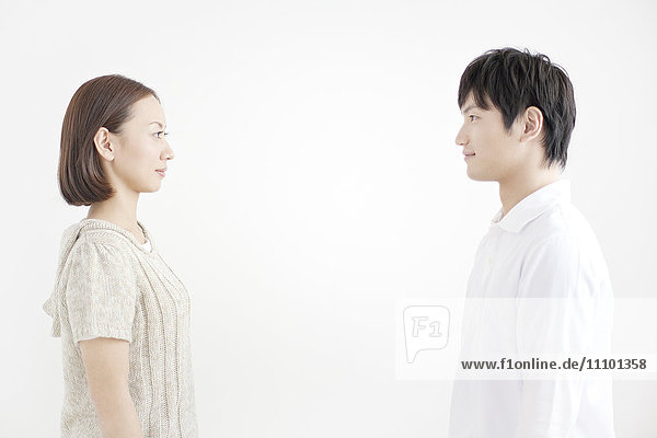 Young couple facing each other