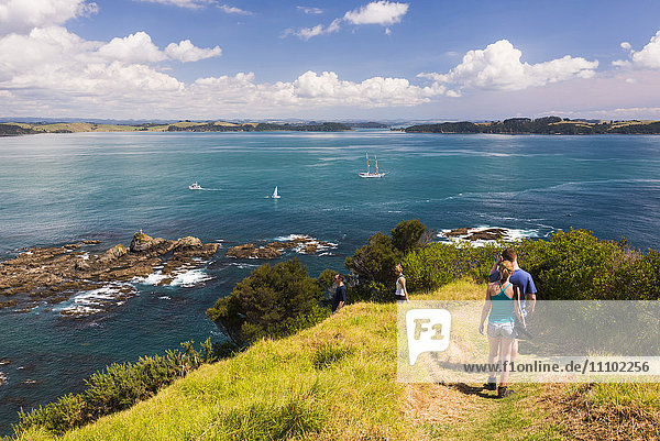 Family walking on Tapeka Point  Russell  Northland Region  North Island  New Zealand  Pacific
