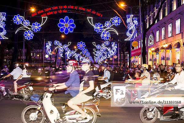 Traffic and Chinese New Year lights  Ho Chi Minh city  Vietnam  Southeast Asia