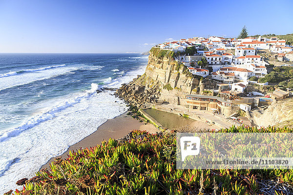 Top view of the village of Azenhas do Mar with the ocean waves crashing on the cliffs  Sintra  Portugal  Europe