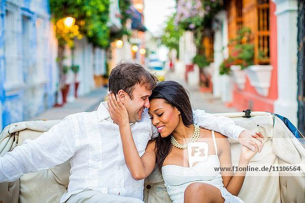 Couple sitting in a horse and carriage  Old Walled-in City  Cartagena  Colombia  South America