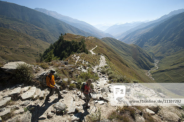 Trekkers make their way east down the Juphal Valley in Lower Dolpa in west Nepal  Himalayas  Nepal  Asia