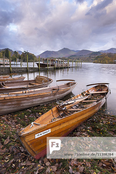 Wooden rowing boats beside Derwent Water in the Lake District National Park  Cumbria  England  United Kingdom  Europe