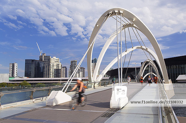 People crossing Seafarers Bridge Melbourne Victoria Australia Pacific