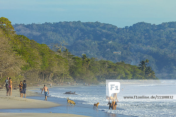 Beach walkers at this hip surf resort near Mal Pais  far south end of the Nicoya Peninsula  Santa Teresa  Puntarenas  Costa Rica  Central America