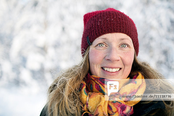 Portrait of smiling woman at winter