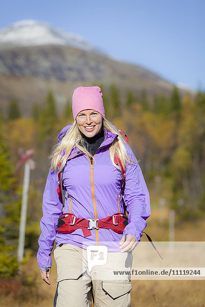 Smiling woman hiking