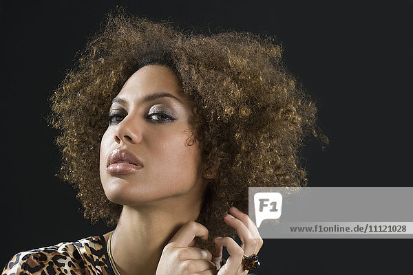 Mixed Race woman pulling hair