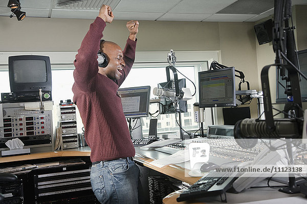 African dj working at radio station