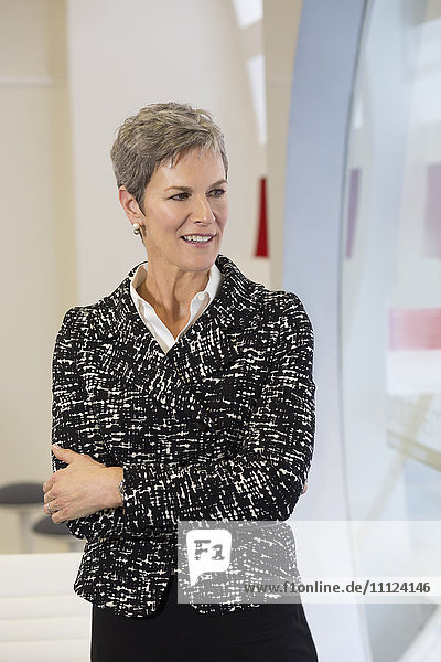 Businesswoman standing in hallway
