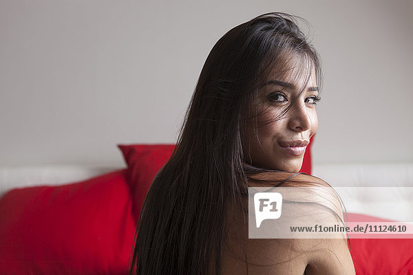 Nude woman looking over her shoulder