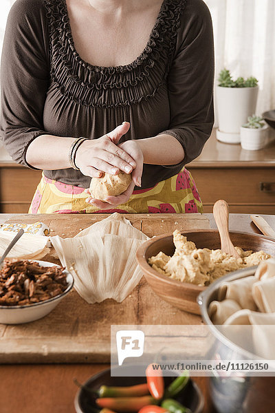 Woman making tamales
