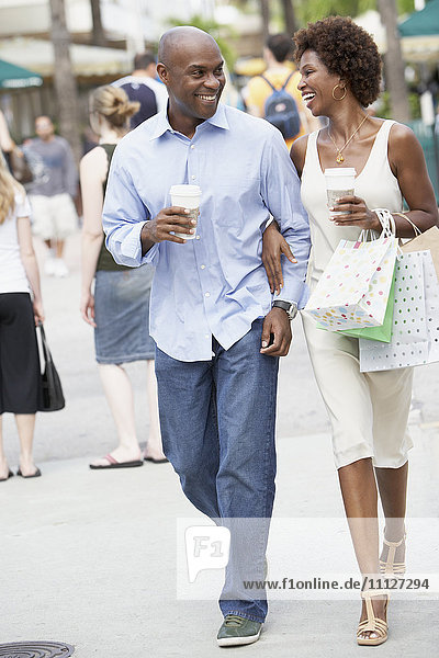 African American couple with shopping bags