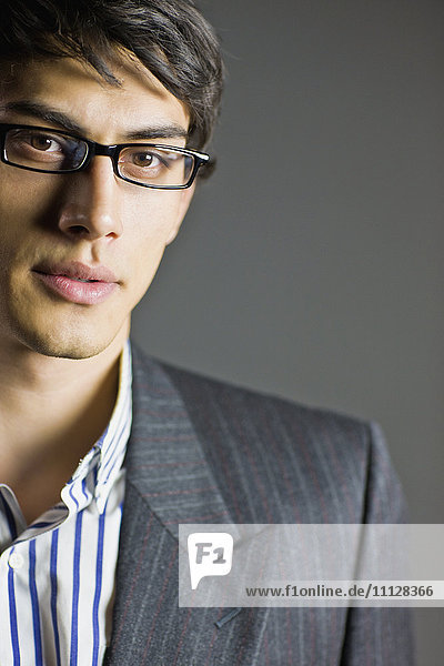 Mixed race businessman in eyeglasses