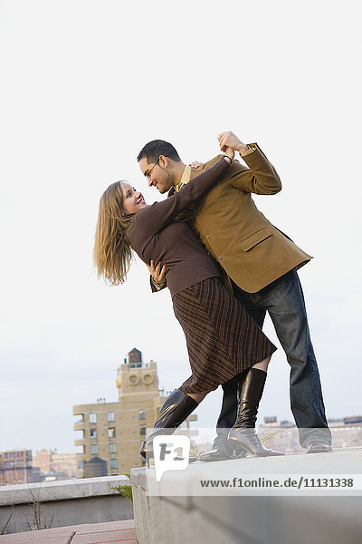 Couple dancing on rooftop