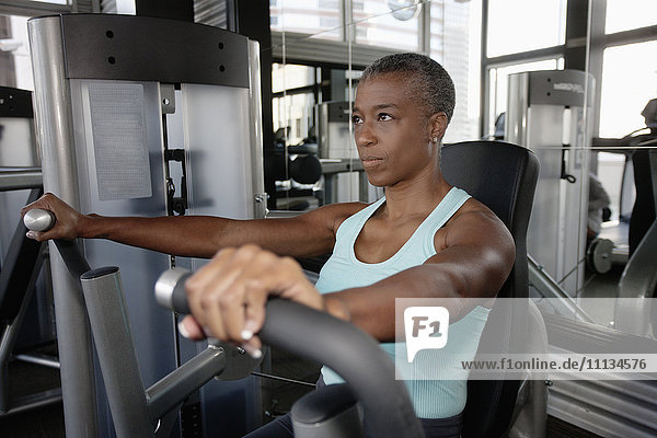 African American woman exercising in health club