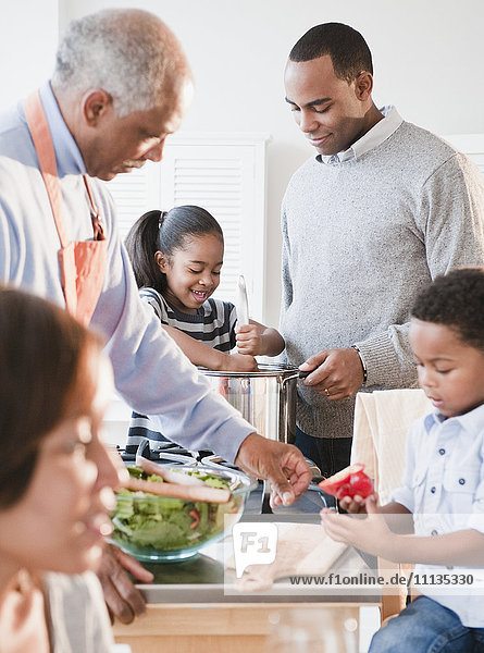African American family cooking together
