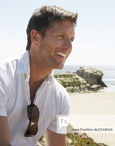Smiling man enjoying beach