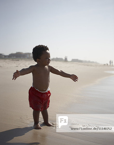 African American baby boy enjoying beach