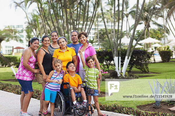 Hispanic family standing together outdoors