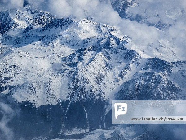 Clouds and snow covered mountains Switzerland