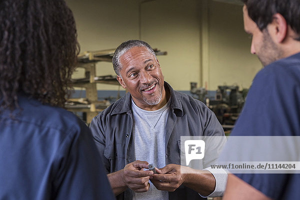 Workers talking in warehouse