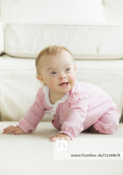 Caucasian baby girl with Down Syndrome