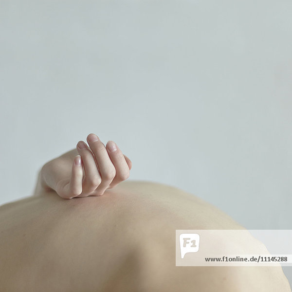Caucasian woman holding pregnant belly
