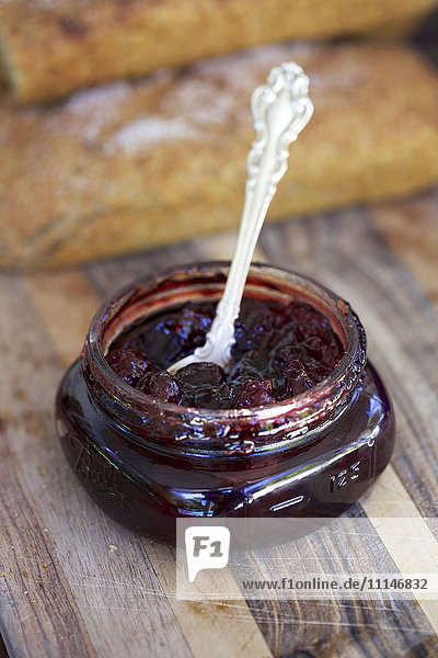 Close up of spoon in jar of jam