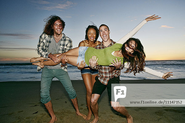 Friends posing together on beach