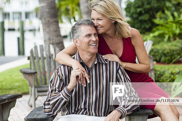 Caucasian couple hugging outdoors