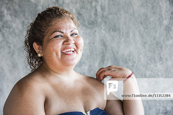Close up of laughing Hispanic woman