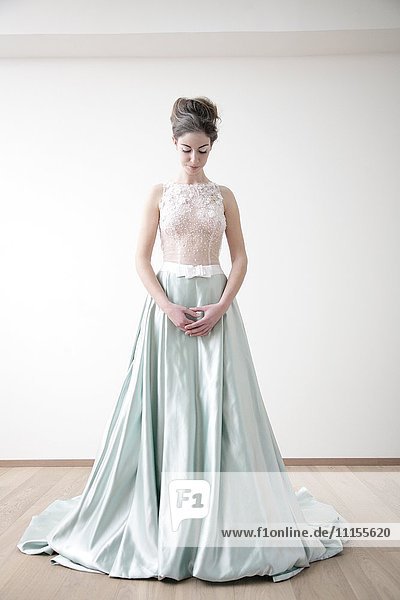 Caucasian bride standing in wedding dress