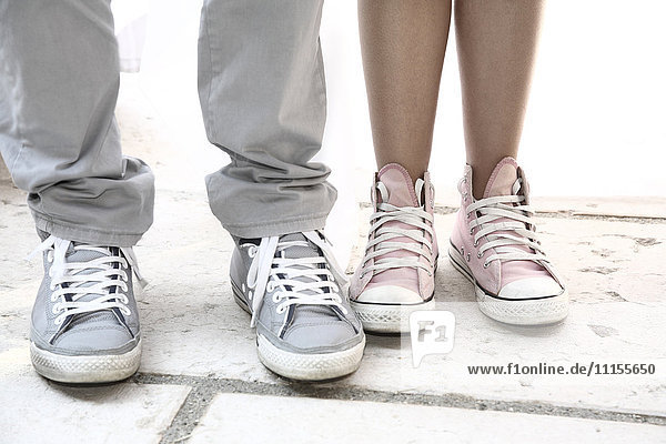 Close up of couple wearing sneakers