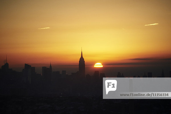USA  New York State  New York City  Cityscape with Empire State building at sunrise