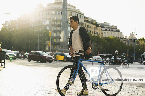 Teenager with a fixie bike in the city