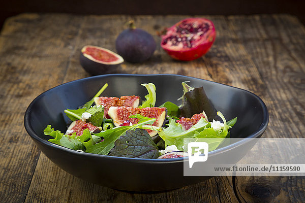 Mixed salad with goat cheese  pomegranate seeds and figs