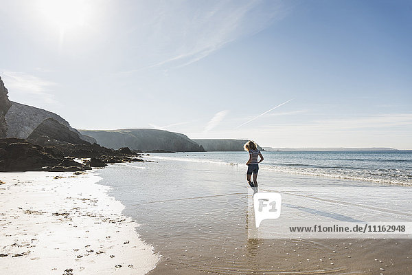 France  Crozon peninsula  teenage girl walking on the beach