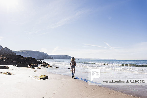 France  Crozon peninsula  teenage girl walking on the beach