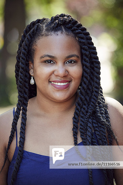 Smiling black woman with braids