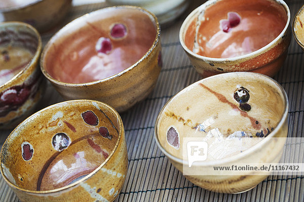 Fired ceramic bowls with design and a variety of finishes and colours.
