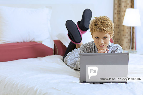 Woman at Home with Laptop Computer